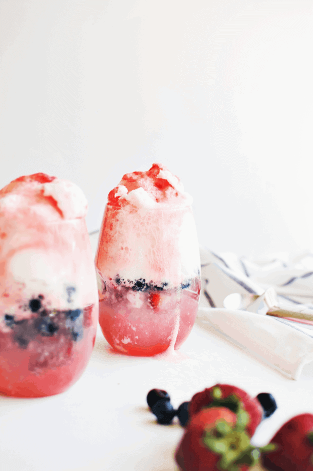 4th of July Ice Cream Floats | Incredibly simple, pretty, and delicious! The mix of the strawberry and lemon lime sodas and the juiciness of the blueberries and strawberries—they are the perfect complement to the creamy vanilla ice cream! || The Butter Half #icecream #icecreamfloats #4thofjuly #thebutterhalf