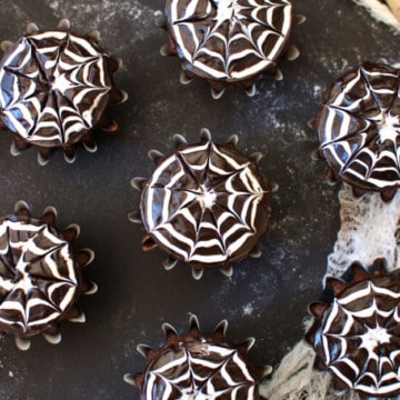 How to Make Spiderweb Cupcakes | halloween dessert recipes, halloween cupcake recipes, halloween treat ideas, homemade halloween treats, cupcake recipes for halloween, spiderweb dessert recipes || The Butter Half via @thebutterhalf