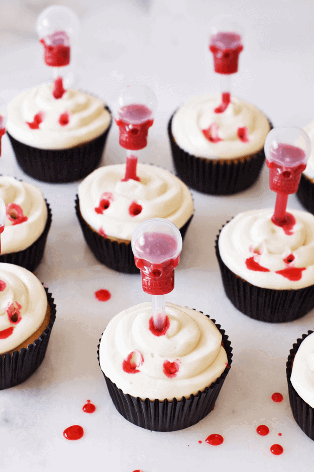 These Spooky Vampire Bite Cupcakes with Edible Blood are amazing Halloween treats! Infusing the cupcakes with edible blood makes them extra sweet and creepy! || The Butter Half #halloweentreats #spookytreats #cupcakes #thebutterhalf
