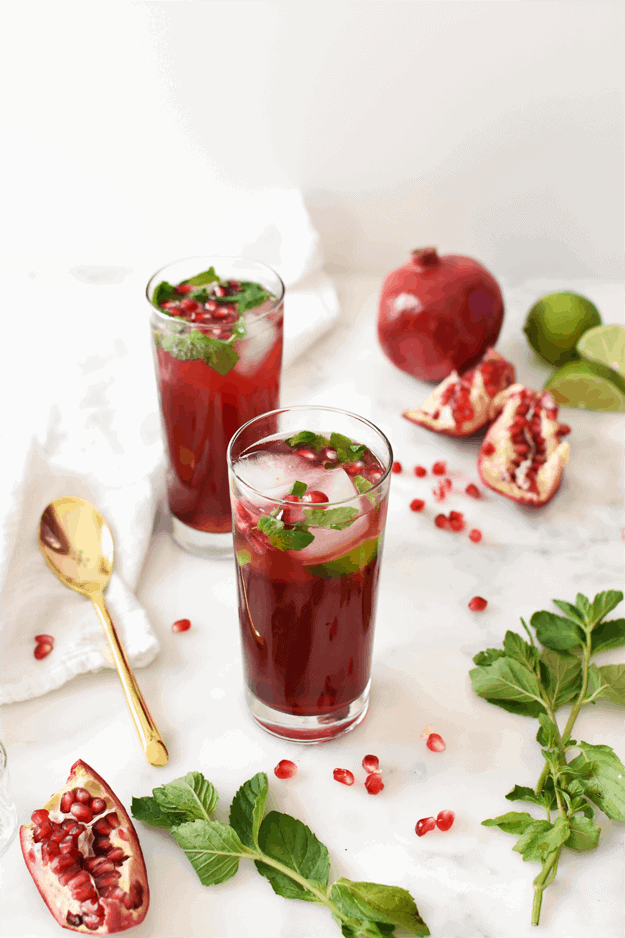 Set the holiday mood with this beautiful pomegranate mojito mocktail. It's a blend of sweet and tart, and takes 5 minutes to make - the perfect refreshment! || The Butter Half #holidaydrinks #holidaymocktail #mocktailrecipes #thebuterhalf