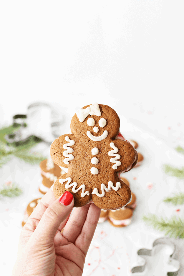 These Soft Gingerbread Man Cookies + Ice Cream Sandwiches are full of all things Christmas. The adorable and delicious gingerbread man cookies and the cool minty taste of peppermint ice cream combine a cookie that is ALMOST too cute to eat. Gluten-Free and kid friendly, these cookies will be the highlight of your Christmas parties! || The Butter Half #gingerbreadcookie #holidaycookies #christmascookies #thebutterhalf