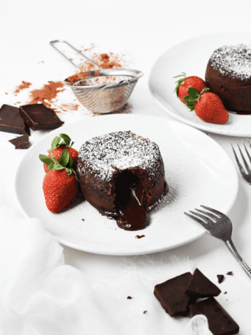Chocolate cake with gooey middle and strawberries
