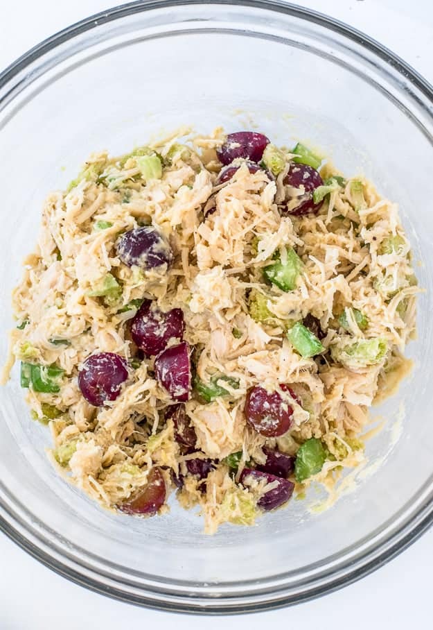 Close up shot of chicken salad with grapes and celery.