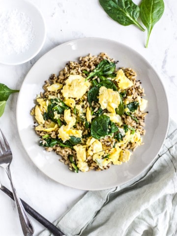 Healthy Brown Rice Breakfast Bowl with Eggs and Spinach