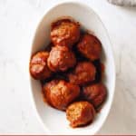 Italian meatballs with sauce in white bowl
