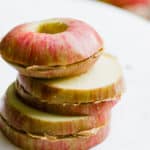 stack of three apple and peanut butter sandwiches