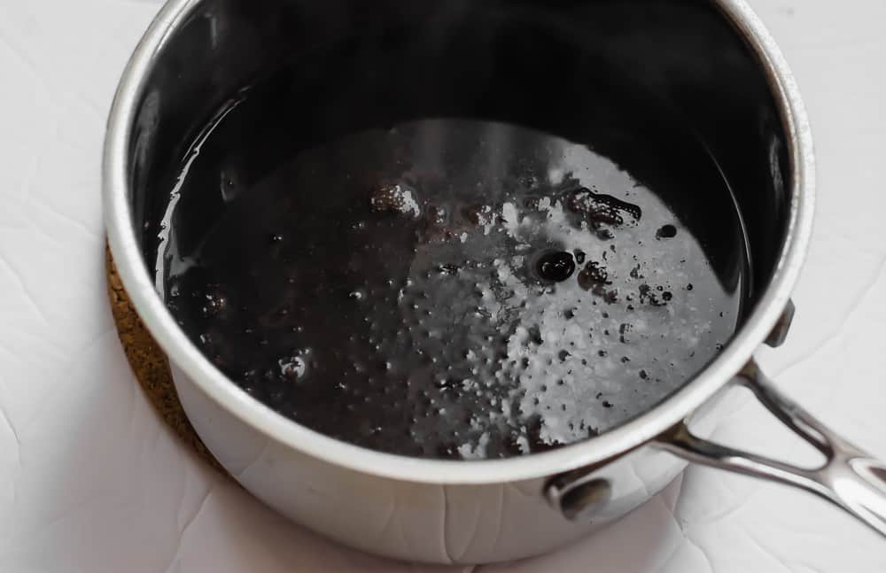 Pot of boiling elderberry syrup