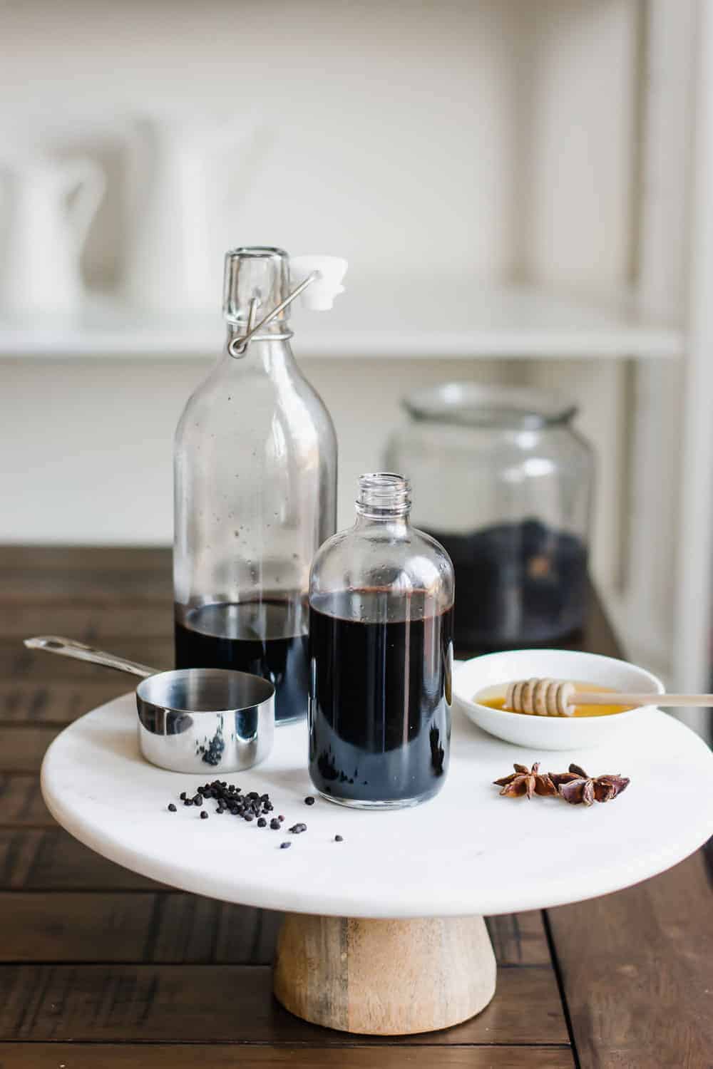 An easy Elderberry Syrup Recipe made with dried elderberries, echinacea, herbs, and honey. Great for colds and supporting the immune system when used medicinally, or used as a syrup for drinks or mixed in with maple syrup as a topping for food. || The Butter Half #elderberry #elderberrysyrup #naturalremedies #herbalremedies #holisticremedies #thebutterhalf