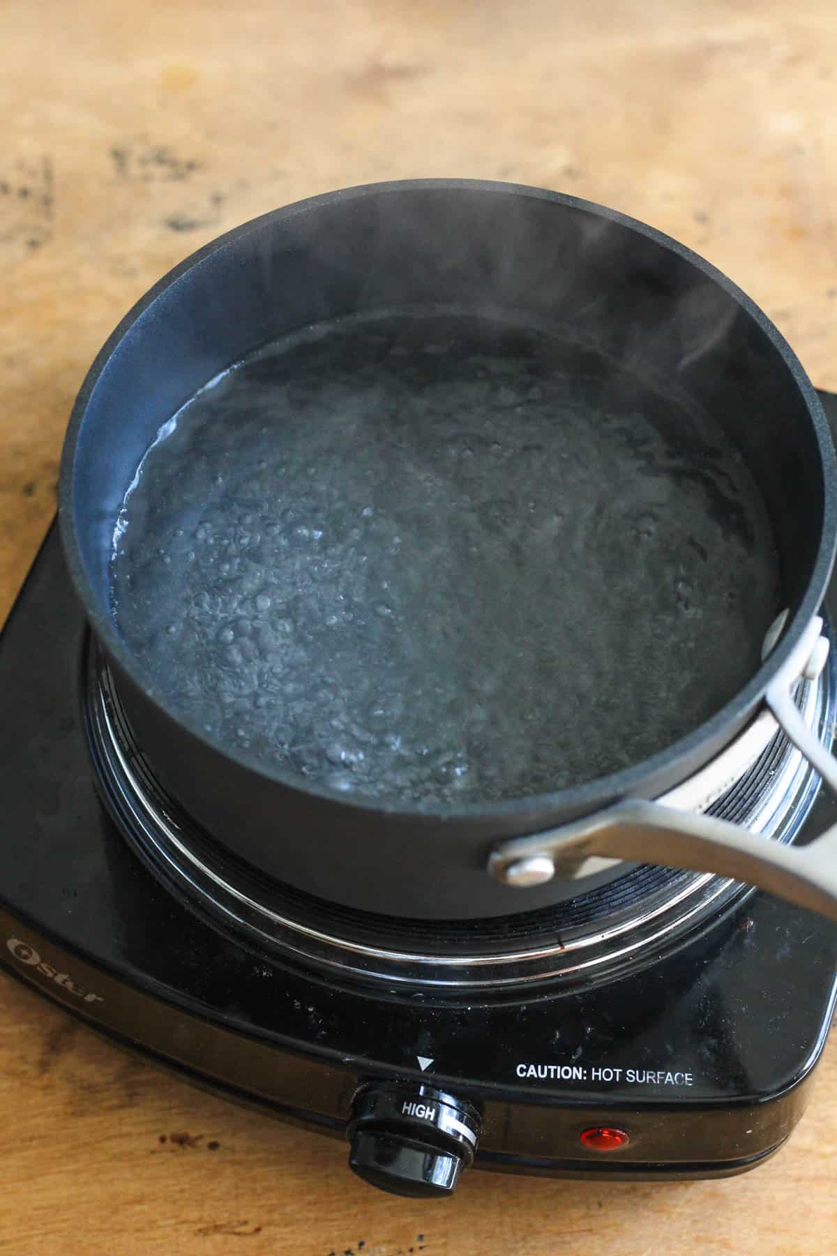 black pot with boiling water