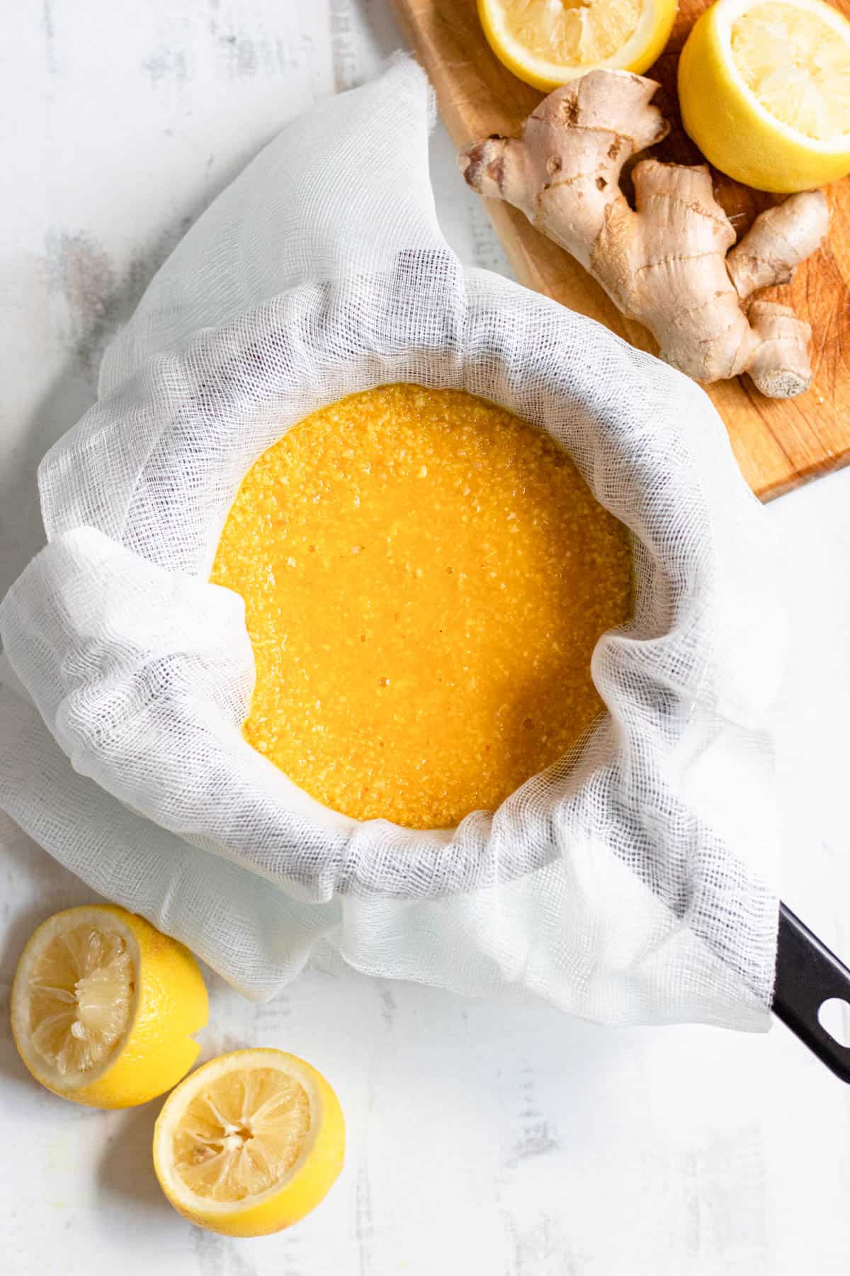 cheesecloth with ginger puree with a light colored background