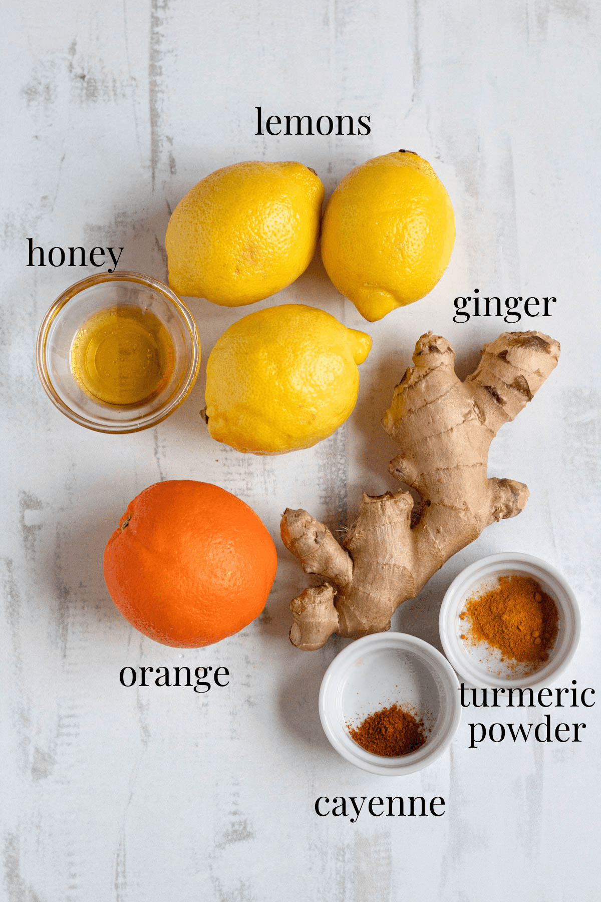 ginger shot recipe ingredients with a light colored background