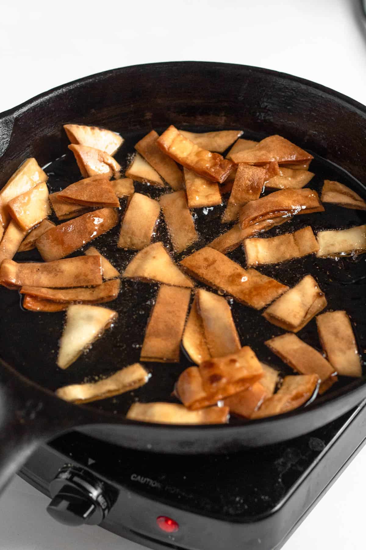pita bread frying in a skillet