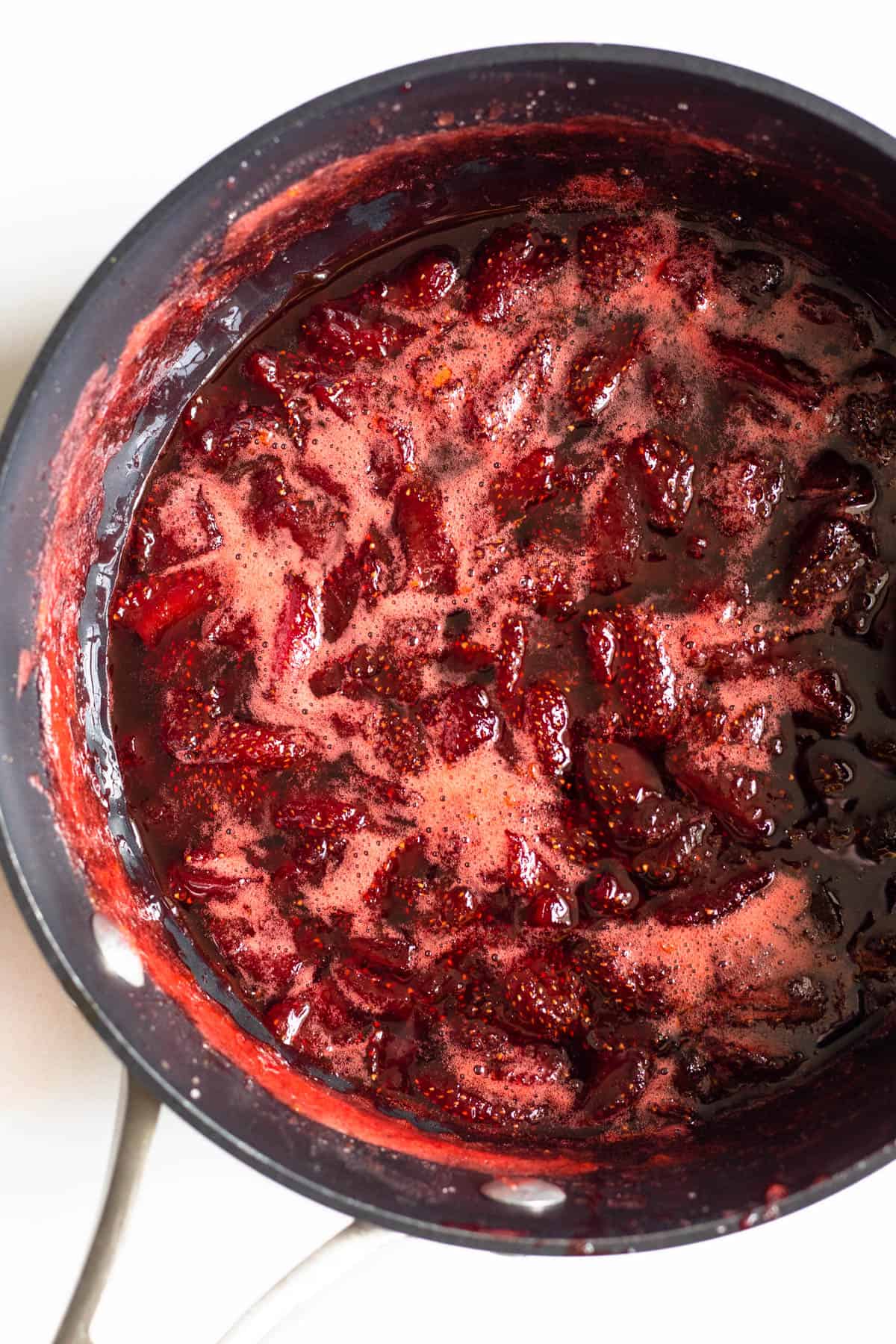 strawberry jam ingredients combined and boiling 