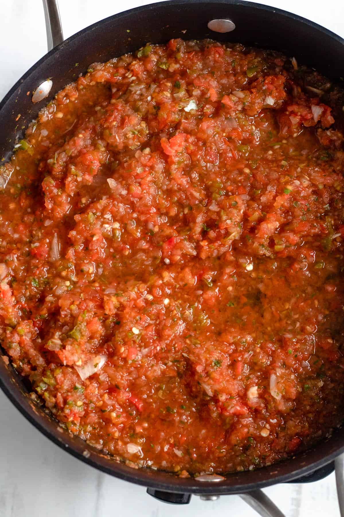 salsa roja in a medium saucepan simmering 