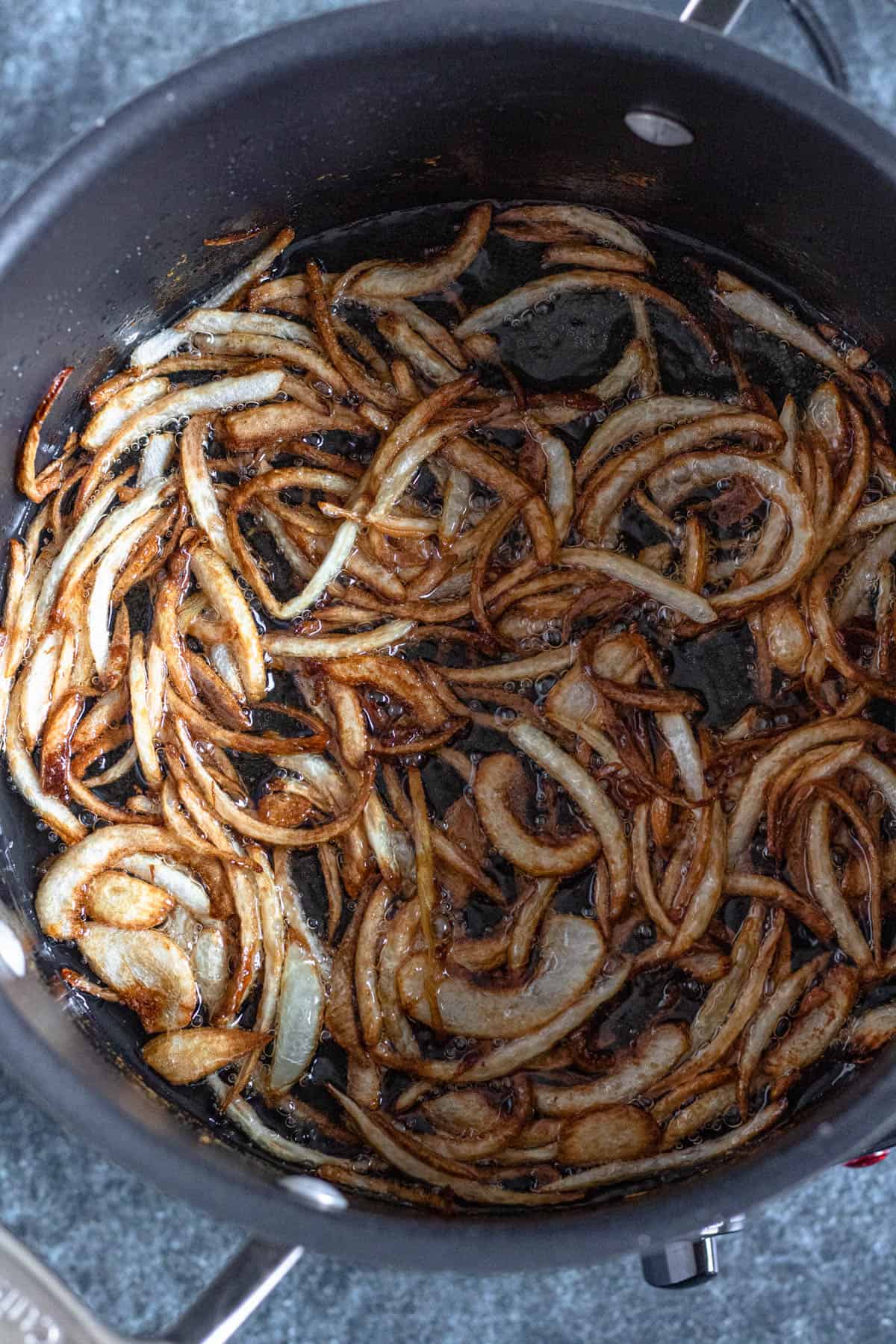 onions in a pot turning golden brown