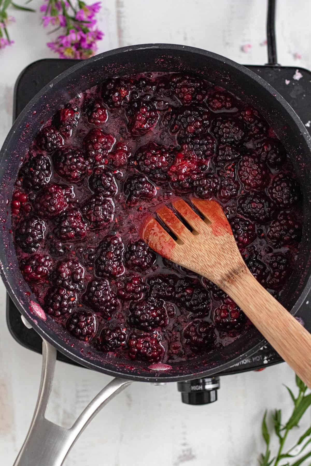 blackberries, granulated sugar, and lemon juice in a medium-sized saucepan giving off juices