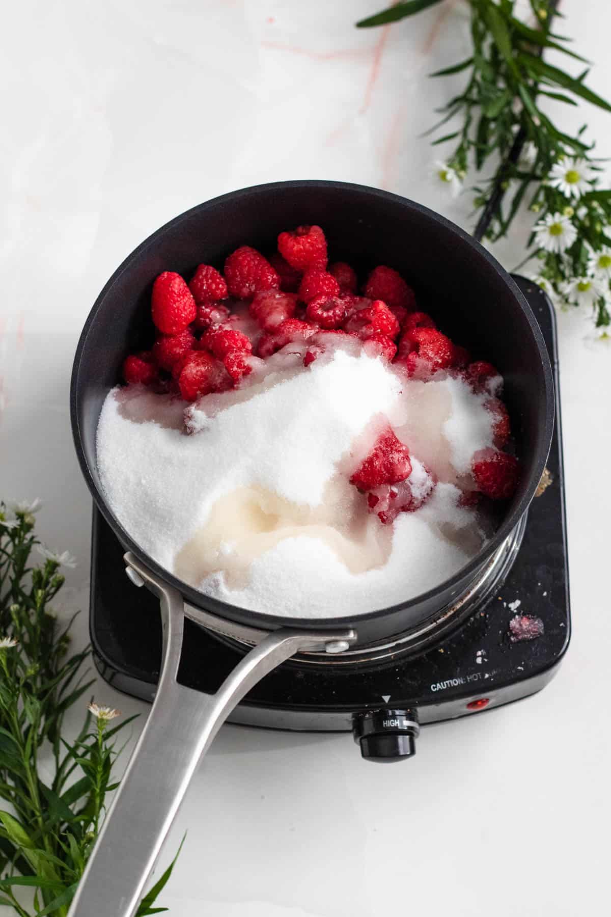 raspberries, sugar, and lemon juice in a medium-sized pot