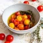 tomato confit in a small glass bowl with a light colored background