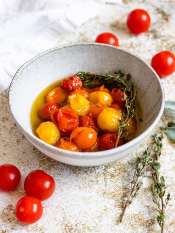 tomato confit in a small glass bowl with a light colored background